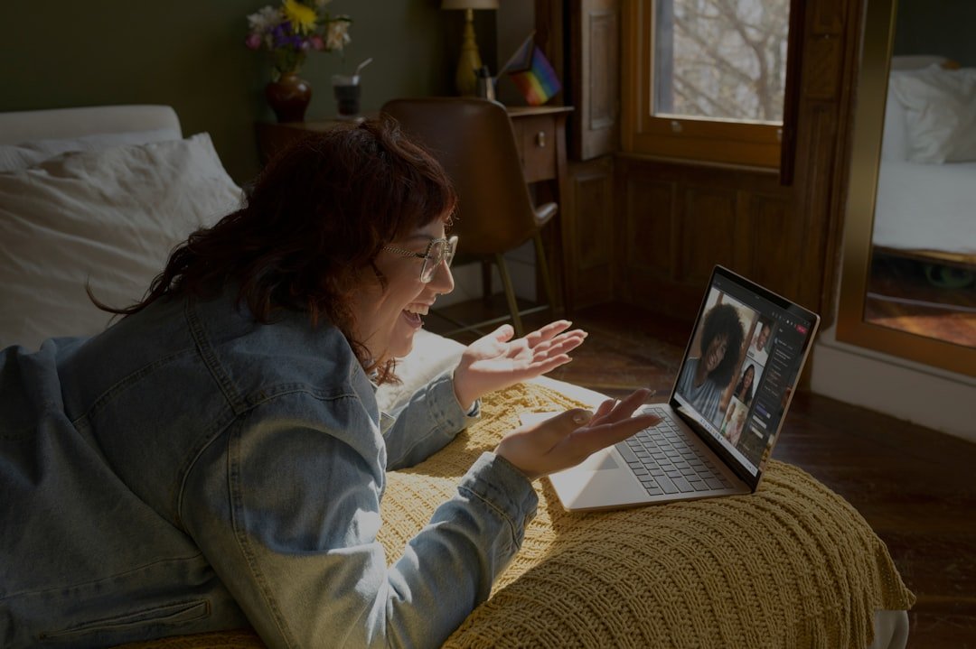Woman on laptop, connecting with distant family on digital memorial.