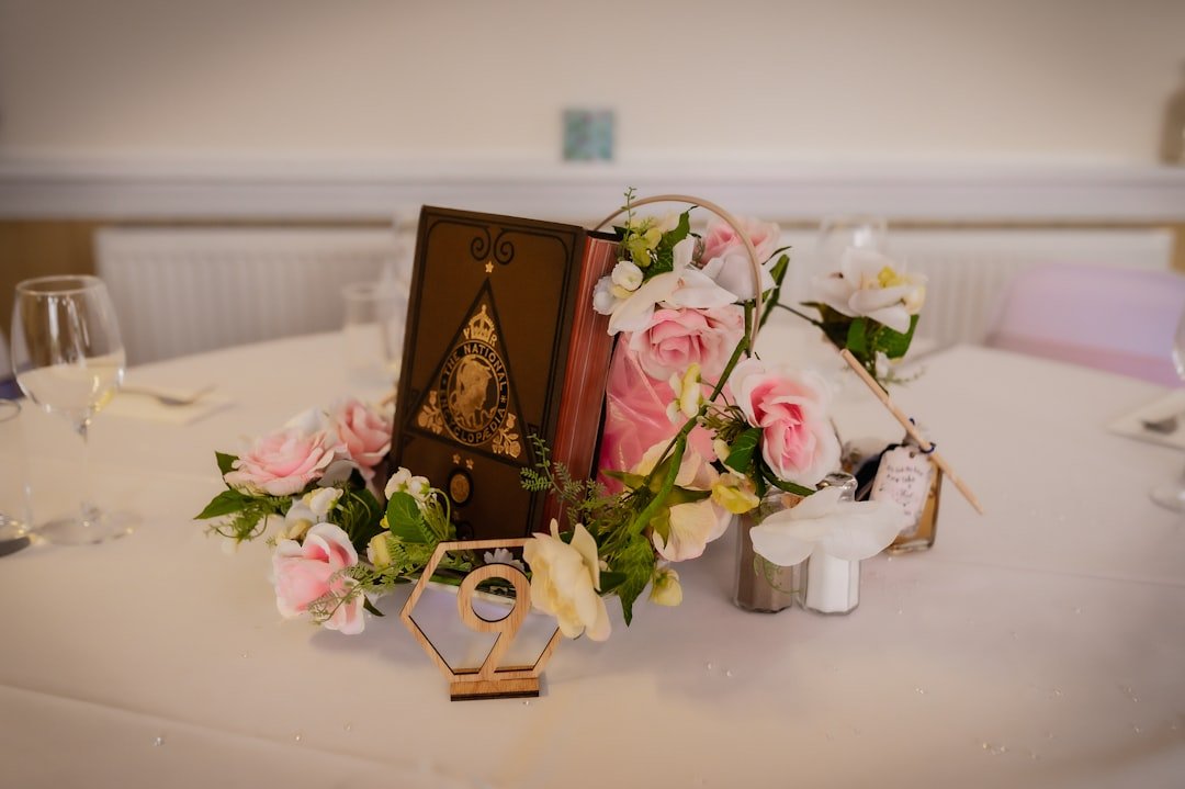 Book & flowers on table: Honoring father's memory.
