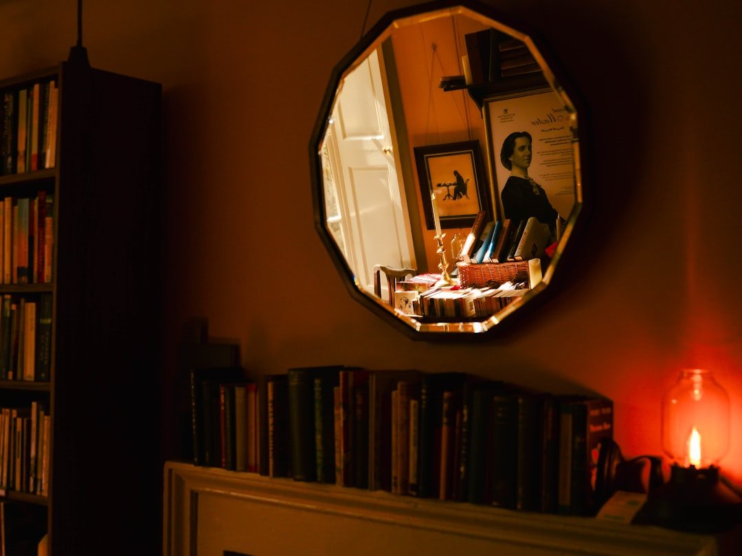 Cozy room, books reflected, remembering Grandma's stories.
