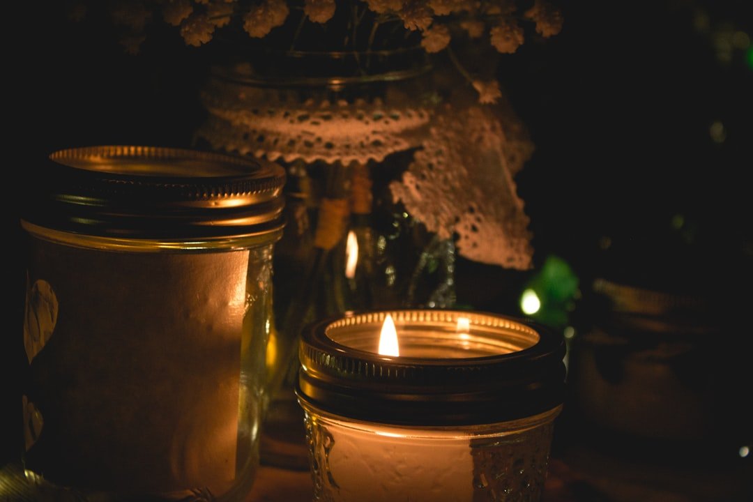 Lighted candle in glass holder, remembering Dad's birthday.