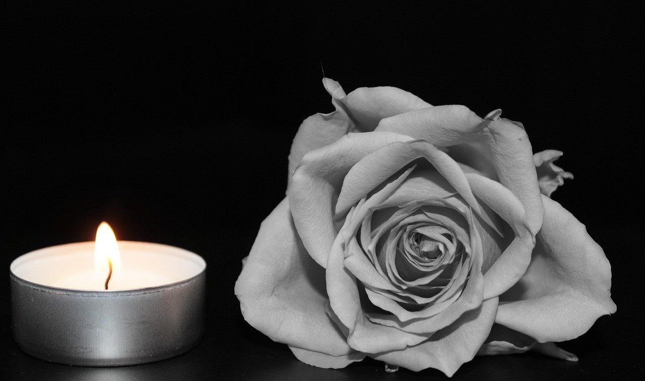 Rose, candle, memorial: In remembrance, grief, consolation, last greeting.