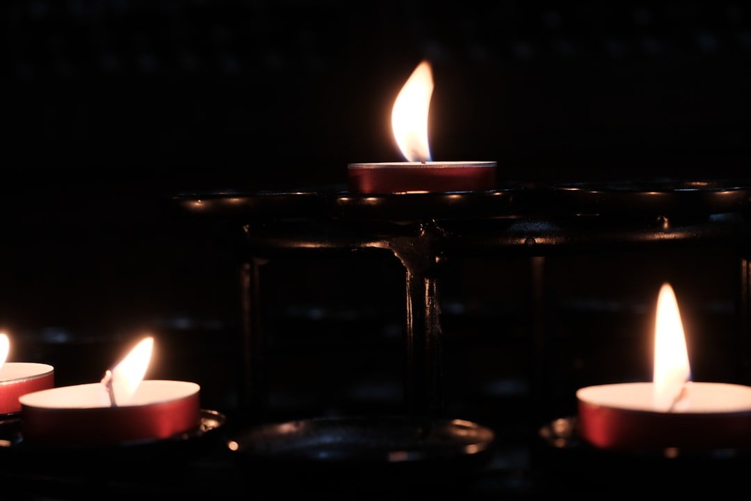 Lit candles on a table, symbolizing digital light.
