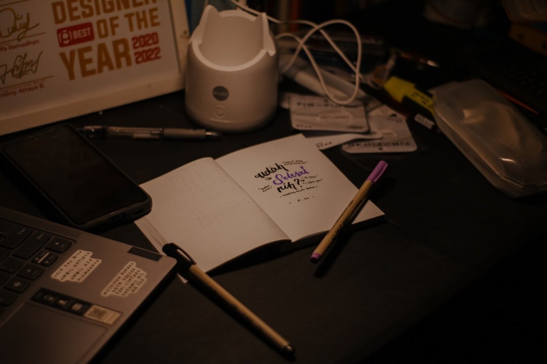 Desk: pens, notepad for writing tribute message.