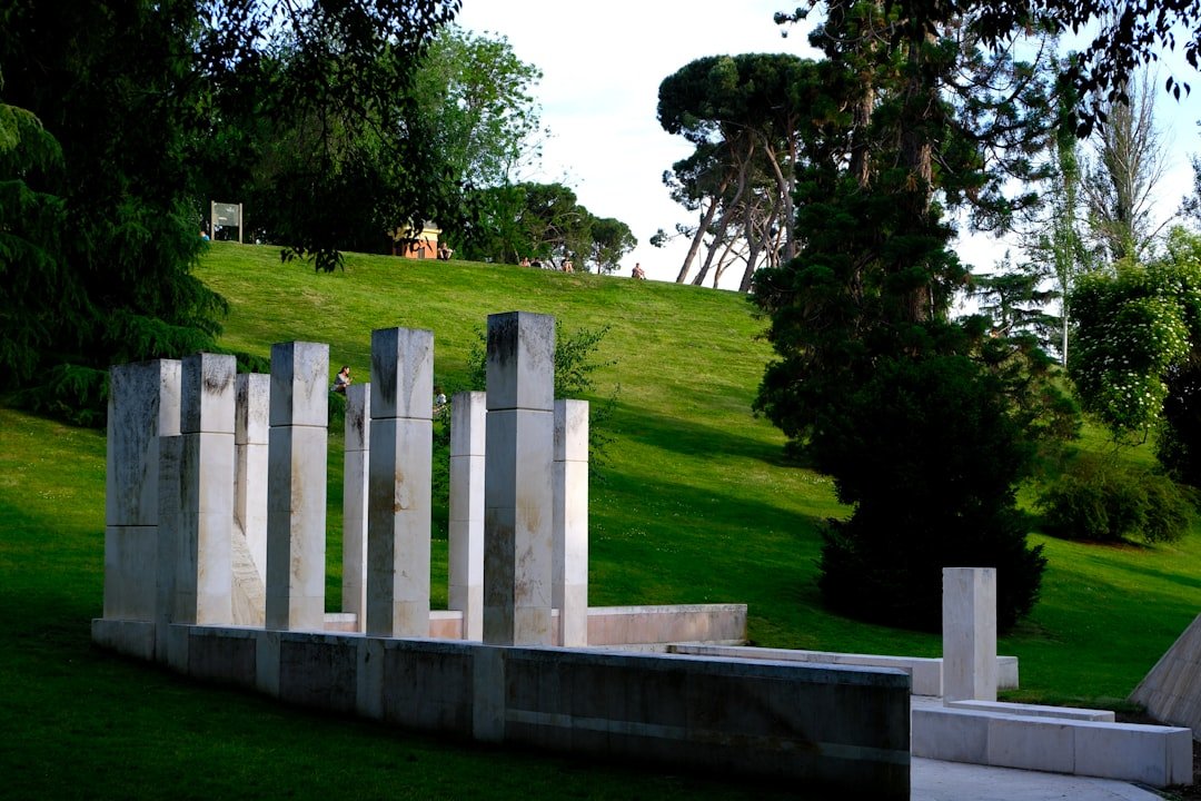 Modern sculpture on green hill; digital memorials explained.