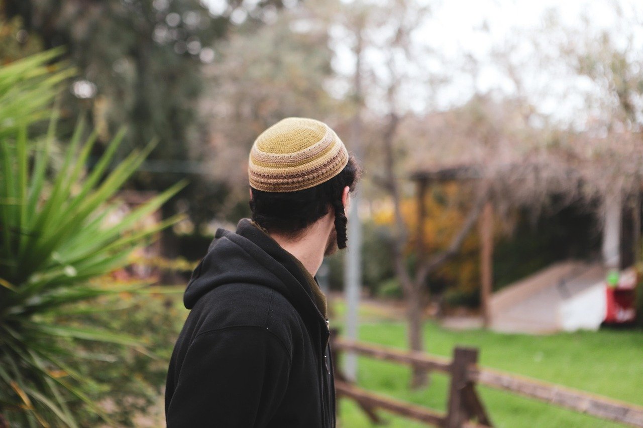 Jewish man mourning shiva, Kaddish, memorial letters.