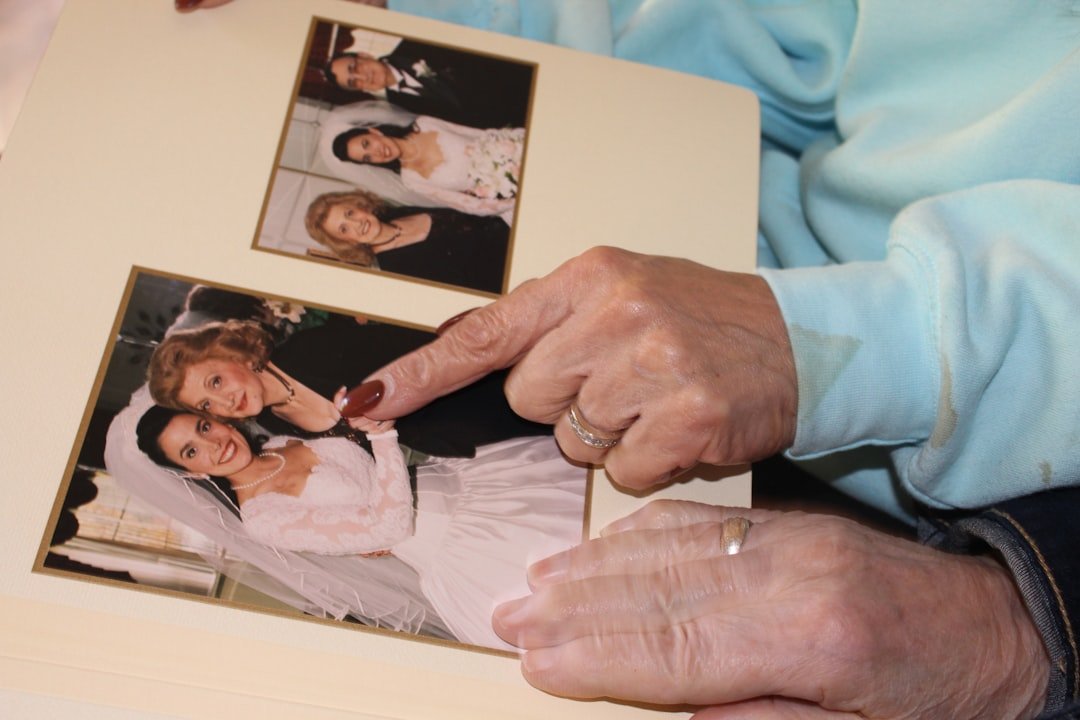 Older woman holds photo, final words, end-of-life hospice care.